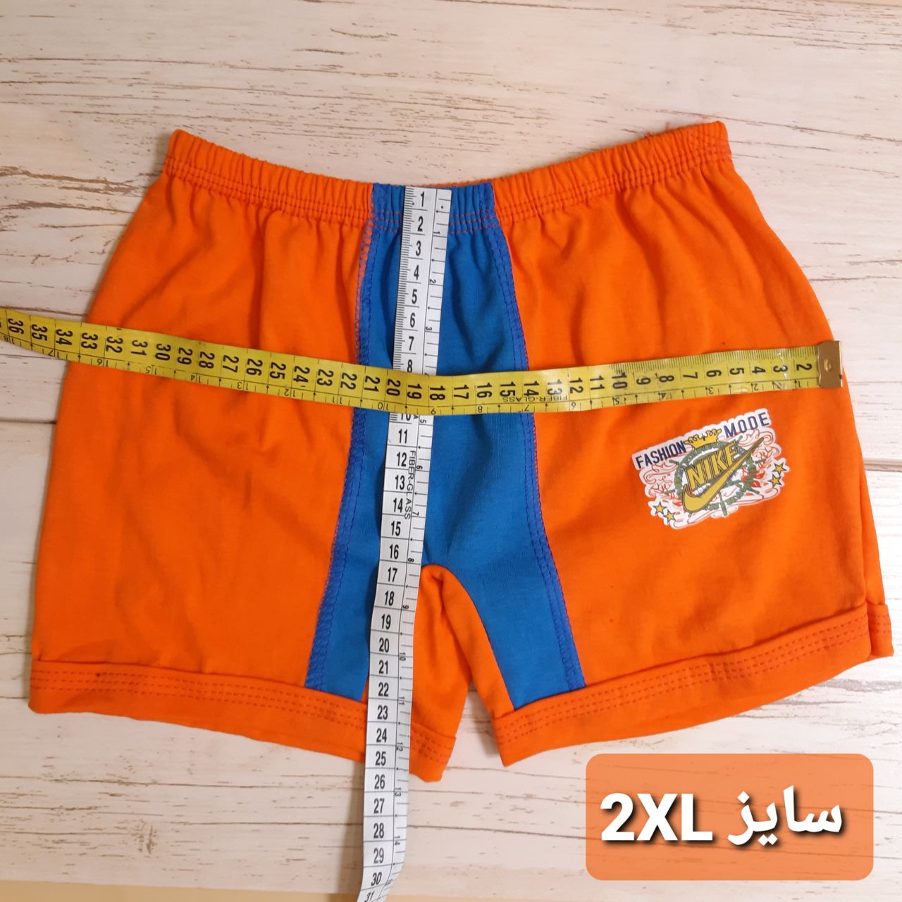 عکس شورت پسر پادار دورنگ - شماره 3