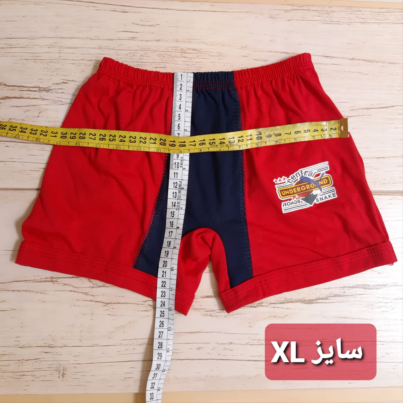 عکس شورت پسر پادار دورنگ - شماره 2